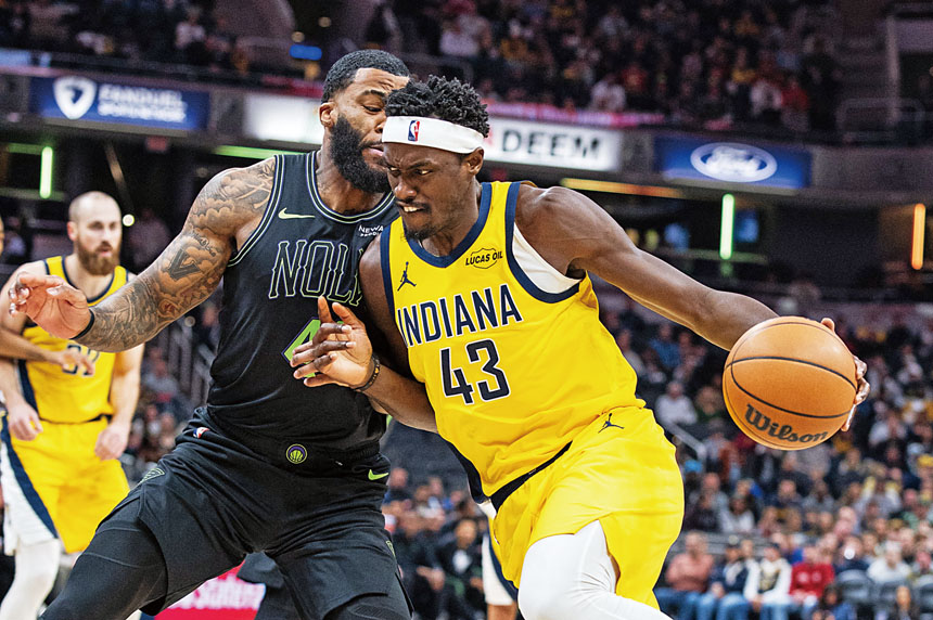 西亞卡姆在鵜鶘球員貼身緊逼防守下帶球突破。路透社