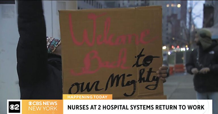 有人舉牌歡迎護士重返西奈山醫院，麥迪遜大道迴盪著重聚的歡呼聲。CBS紐約截圖
