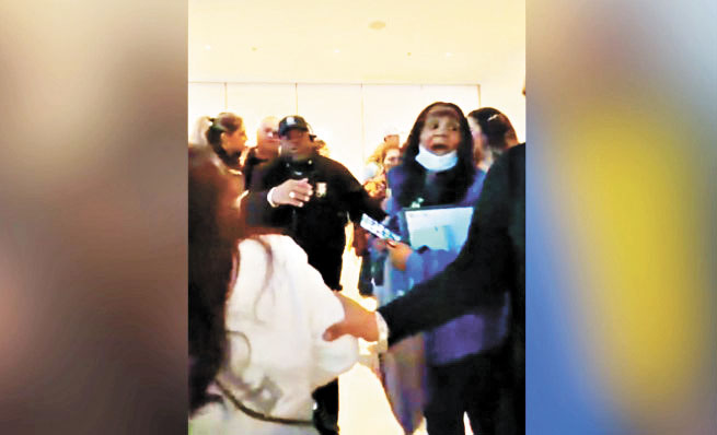 一名SoFi體育場工作人員與拉丁裔音樂會觀眾發生爭執，被人拍到威脅要報警。觀眾截圖