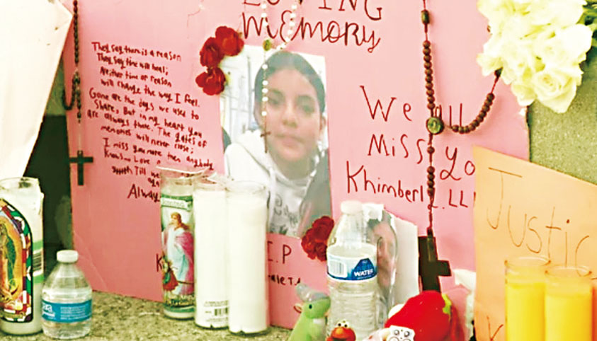 朋友和家人在雷塞達特許高中外替12歲的金伯莉設立了臨時悼念區。 CBSLA