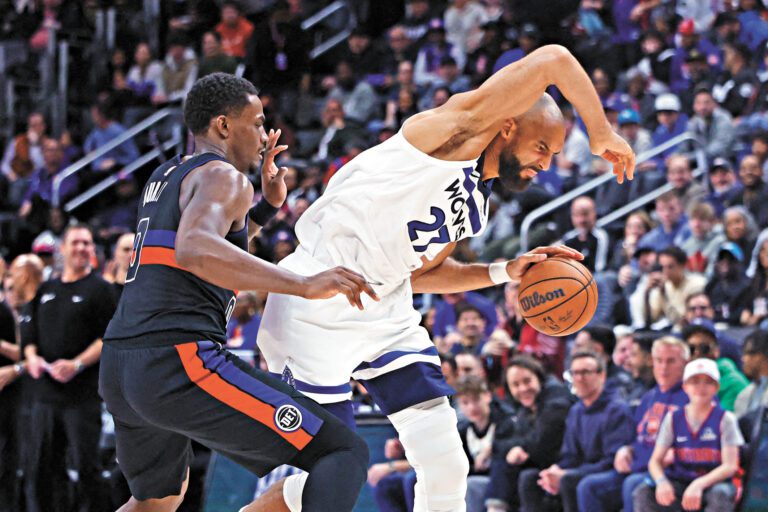 活塞隊和森林狼隊球員激烈攻防。路透社