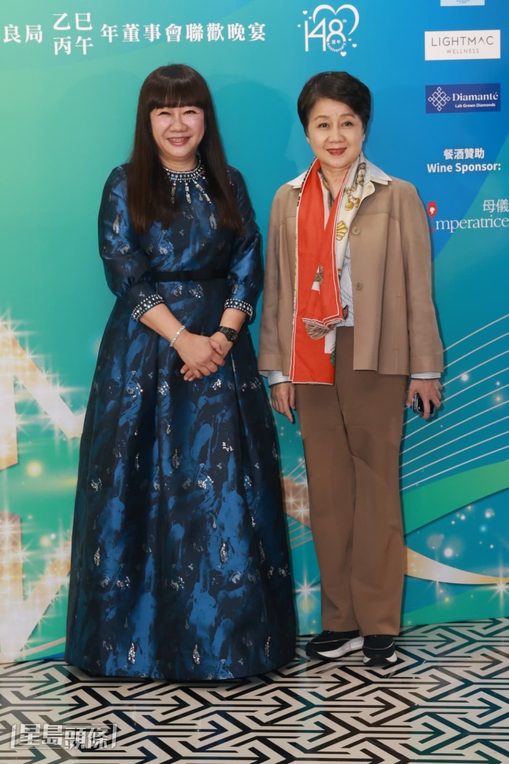 保良局丙午年董事會主席譚毓楨博士與梁安琪在晚宴上合影。