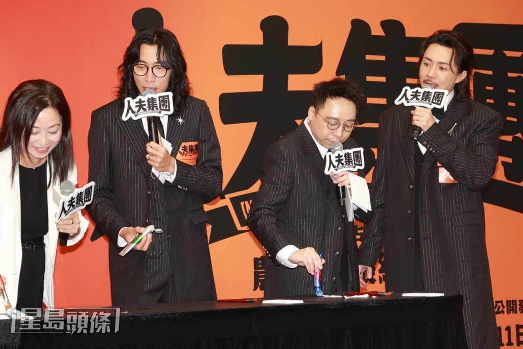 農夫與張繼聰在記者會上執筆揮毫。