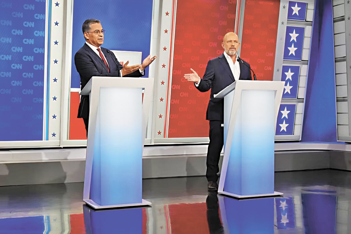 州長候選人貝塞拉(左)和希爾頓參與CNN主持的辯論。CNN